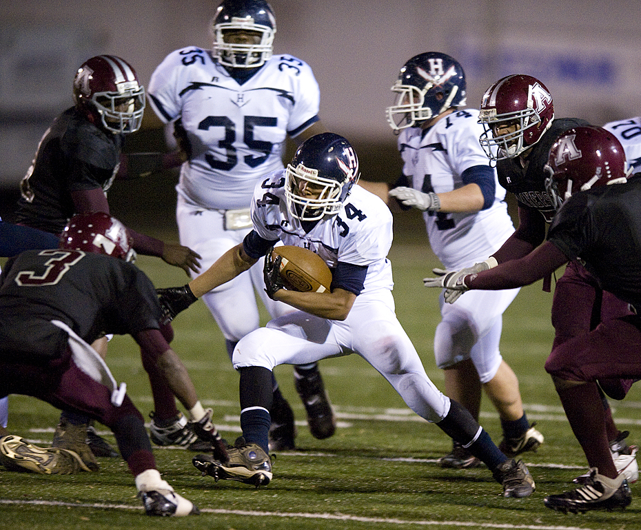 Harrisonburg's Corbin Whitelow looks for a gap in the Amherst defense during second quarter action in the regional final Friday night.