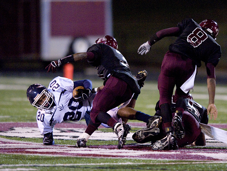 Harrisonburg's Michael Holmes is caught for a loss during first quarter action in Amherst Friday night.