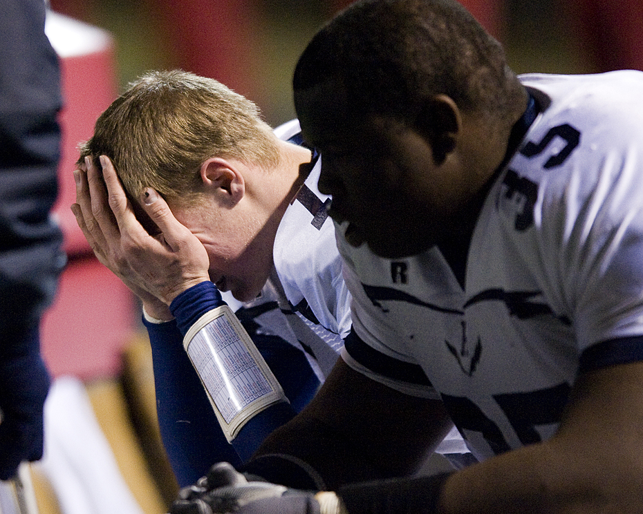 Harrisonburg quarterback Jake Johnson on the sideline after a fumble that resulted in another Amherst touchdown.