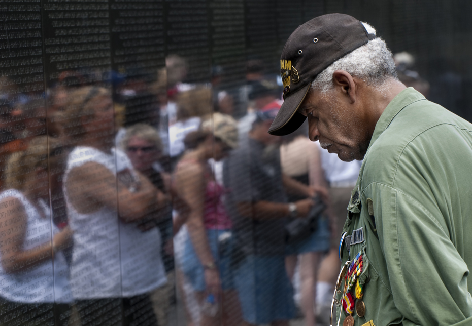 Charles J. Smith stood in the same spot in front of the Vietnam Veterans Memorial for more than an hour.Wearing a green army jacket and holding a framed photograph behind his back, Smith bowed his head and stared at a name inscribed on the granite monument. The name was that of a friend, James E. Pierce.