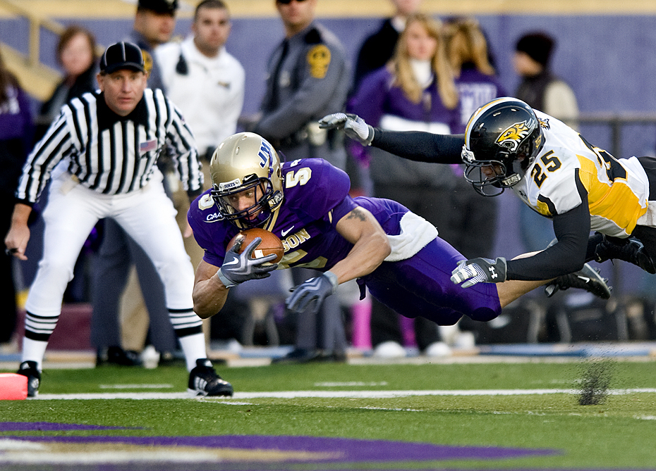 James Madison's Bosco Williams dives across the goal line for a touchdown during third quarter against Towson during an NCAA college football game at Bridgeforth Stadium in Harrisonburg, Va. on Saturday, Nov. 21, 2009.