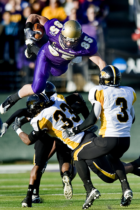 James Madison's Mike Caussin goes airborne against Towson during first quarter during an NCAA college football game at Bridgeforth Stadium in Harrisonburg, Va. on Saturday, Nov. 21, 2009.