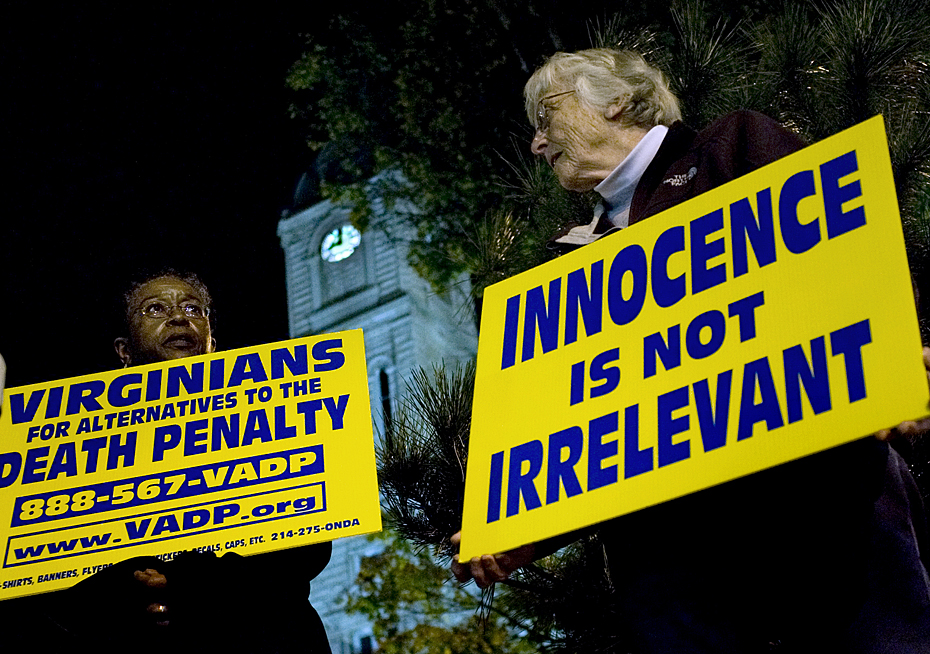 J.B. Walker (left) of Harrisonburg and Barbara Kinsman, of Bridgewater attend a vigil, organized by the Harrisonburg Unitarian Universalist Social Justice Committee was held in Harrisonburg on Court Square during the 9 p.m. execution of John Allen Muhammad. 