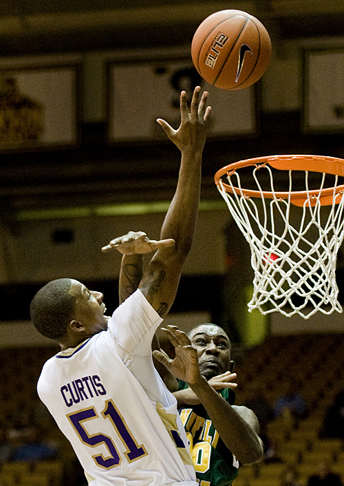 James Madison's Peirre Curtis scores his 1000th career point during first-half action against Norfolk State in Harrisonburg on Wednesday.