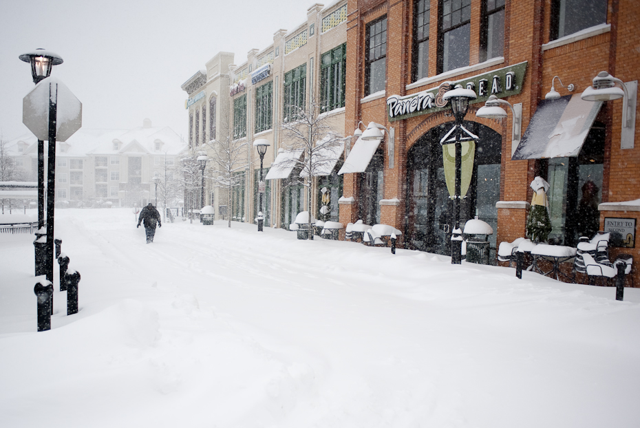 A man braves the elements in Woodland Park Crossing in Hendon.