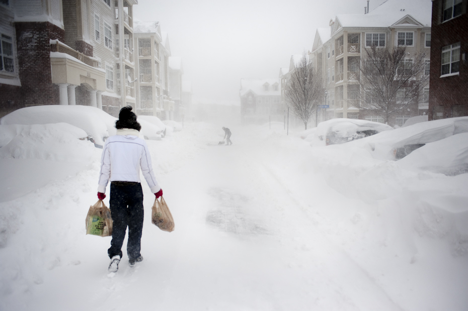 A woman returns from the supermarket across the street from our apartment complex in Herndon.