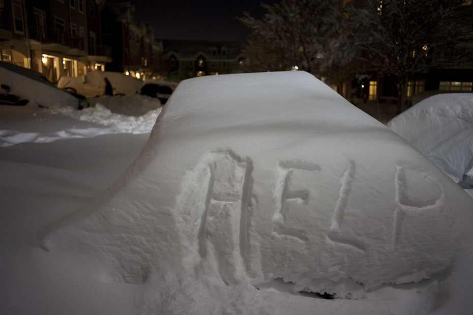 Someone wrote a plea for help on a car in Herndon, Va following what people we calling an epic snow in Northern Virginia and D.C. Metro area.