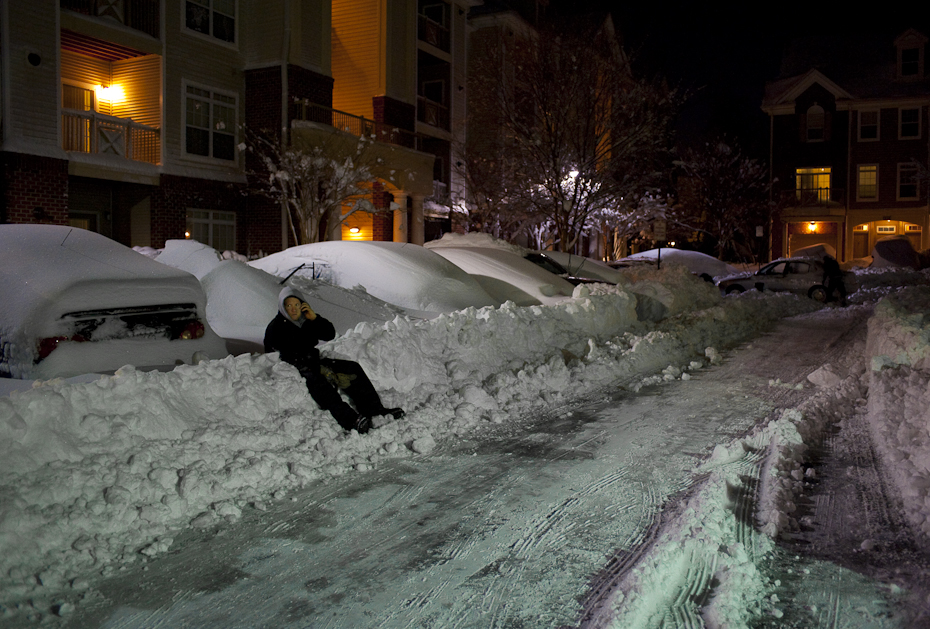 A man takes a break from shoveling snow at his apartment complex in Herndon, Va following what people we calling an epic snow in Northern Virginia and D.C. Metro area.