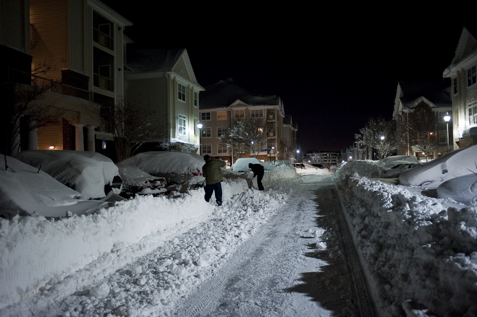 Men dig out their cars at their apartment complex in Herndon, Va following what people we calling an epic snow in Northern Virginia and D.C. Metro area.